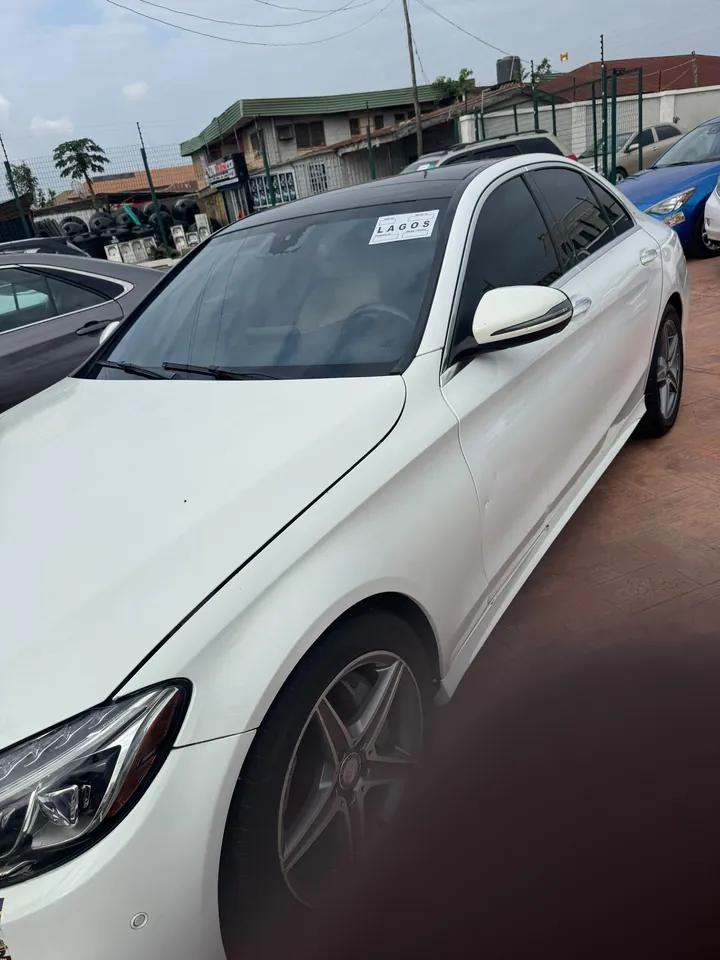 2016 Mercedes-Benz C300 4MATIC, white, front 3/4 (side view), photo 3 of 7